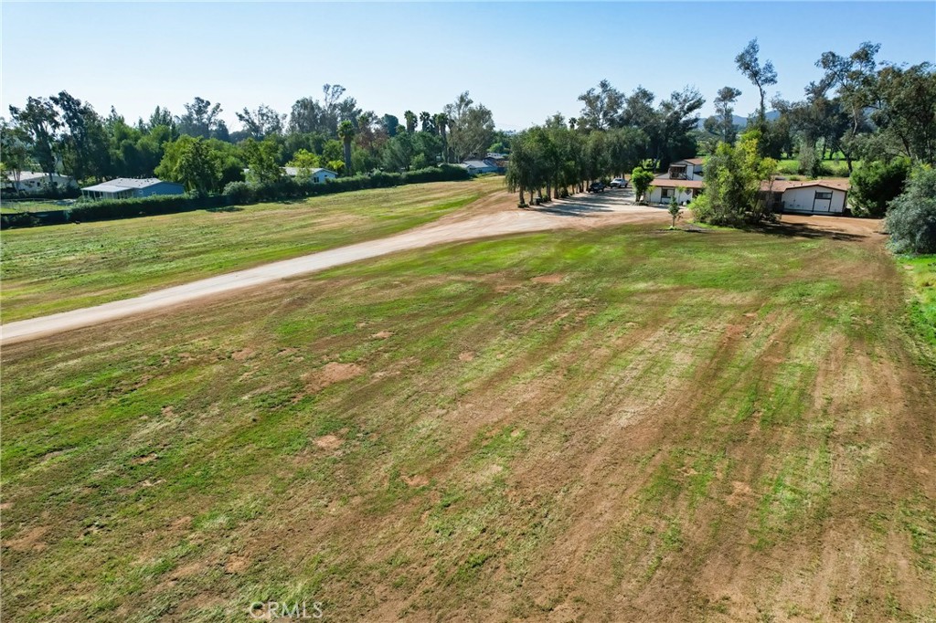 27355 Scott Road Menifee, CA 92584 - Photo 8 of 10 a view of yard with swimming pool and trees in the background
