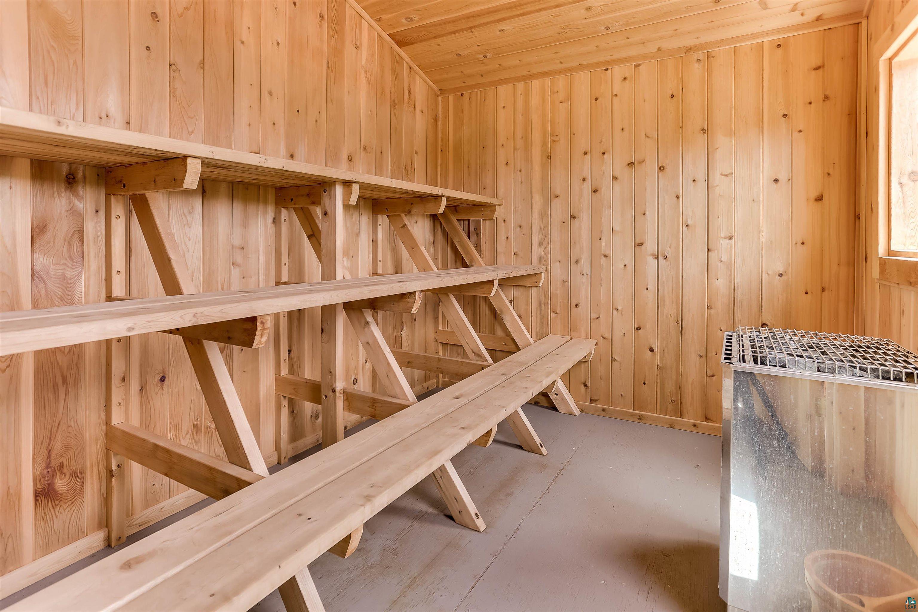 3801 Fenske Lake Road Ely, MN 55731 - Photo 18 of 18 Sauna / steam room with wooden walls and concrete flooring