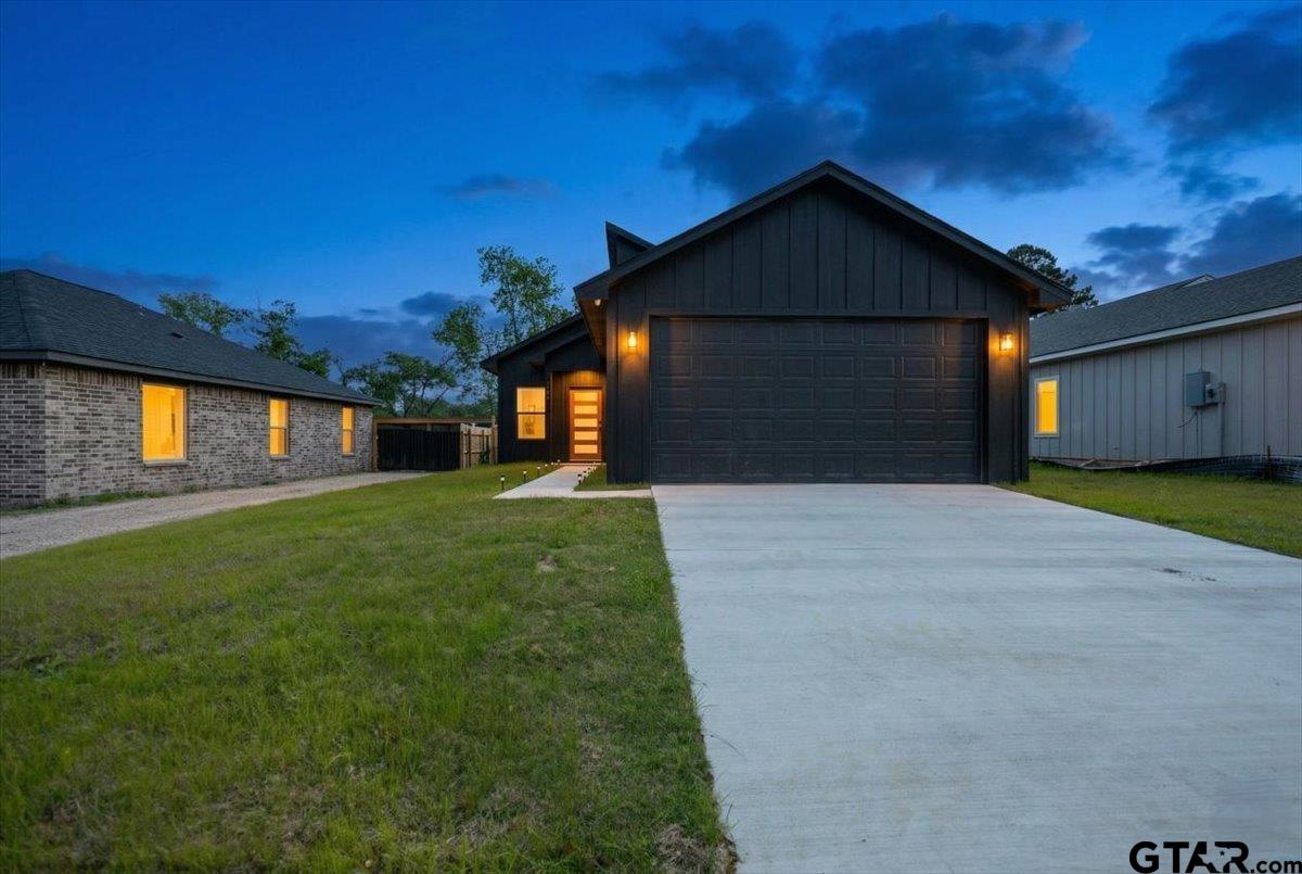 228 South Fenton Avenue Tyler, TX 75702 - Photo 1 of 46 a front view of a house with a yard and garage