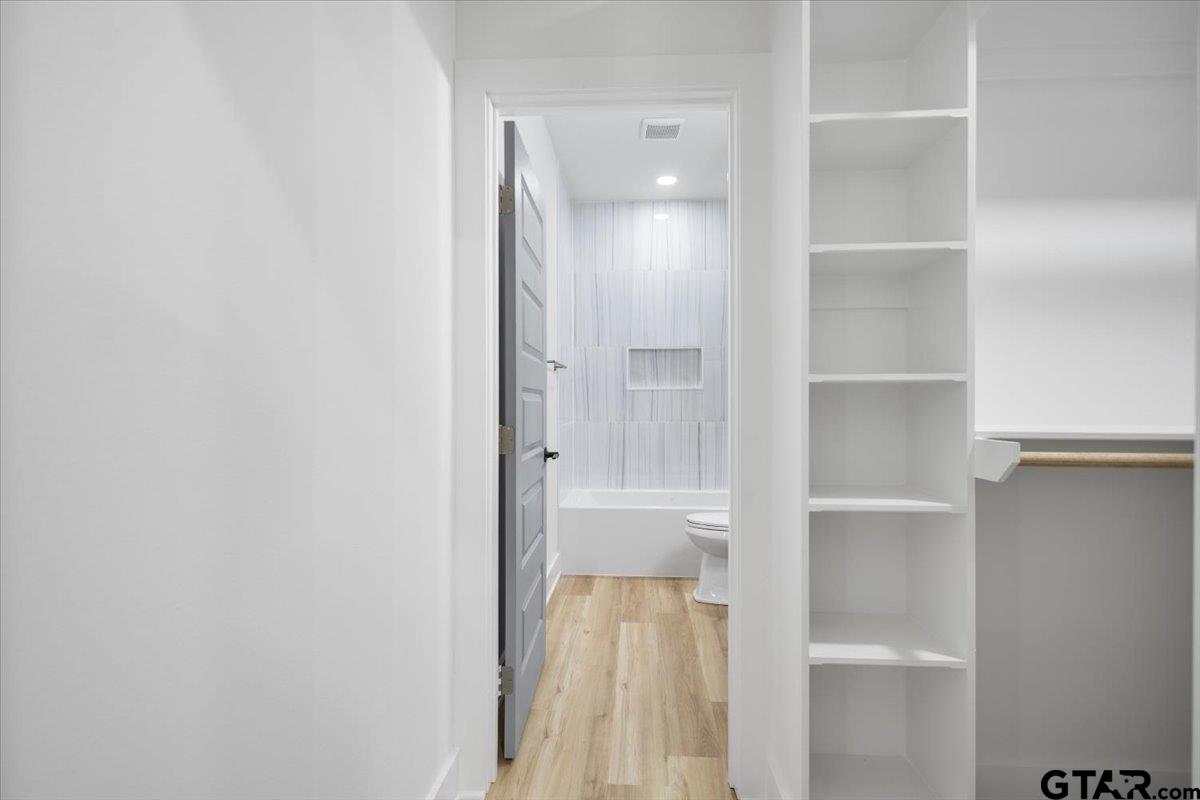 228 South Fenton Avenue Tyler, TX 75702 - Photo 31 of 46 a view of walk in closet with empty racks