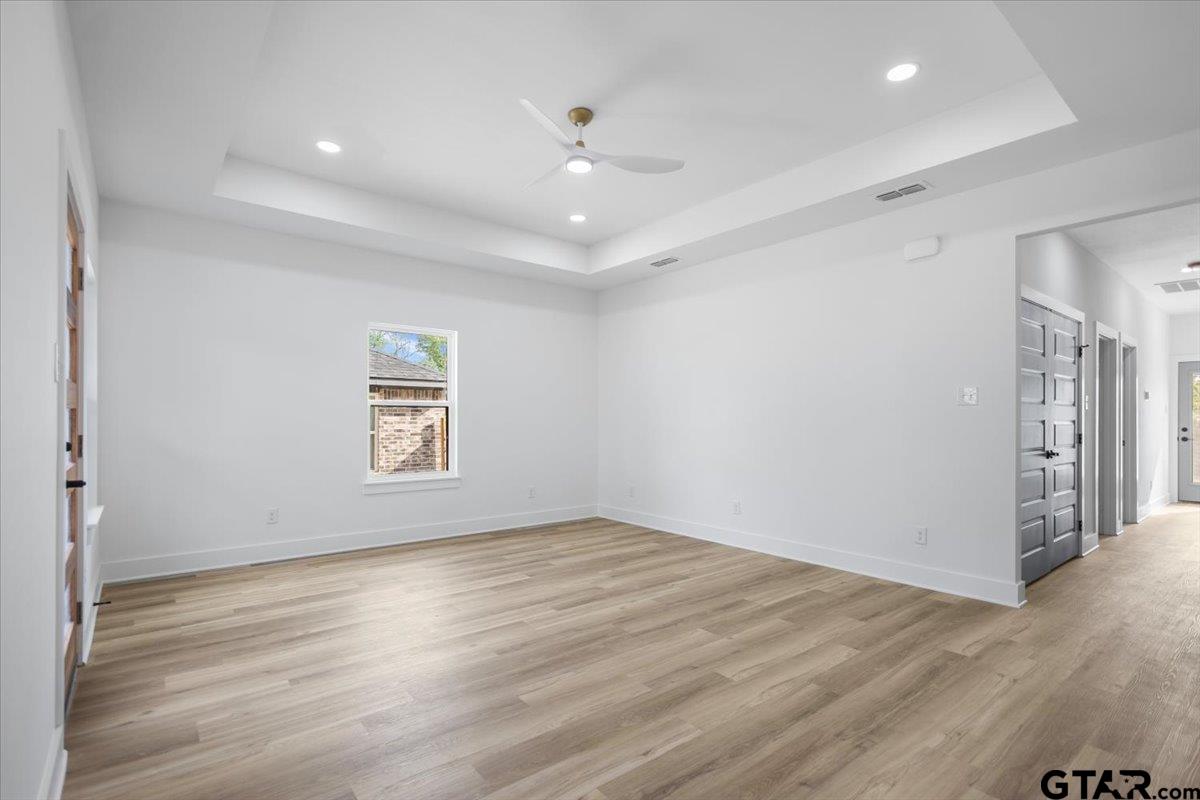228 South Fenton Avenue Tyler, TX 75702 - Photo 9 of 46 wooden floor in an empty room with a window