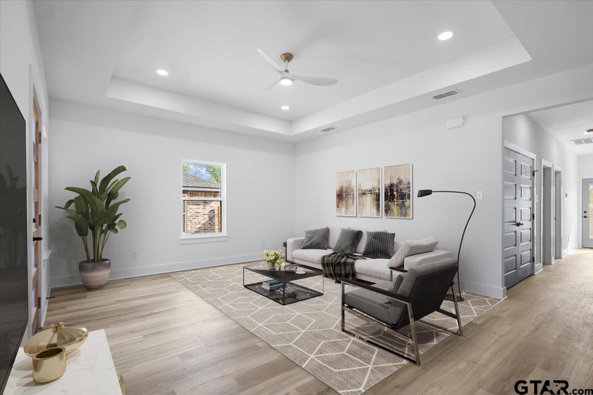 228 South Fenton Avenue Tyler, TX 75702 - Photo 10 of 46 a living room with furniture and a potted plant
