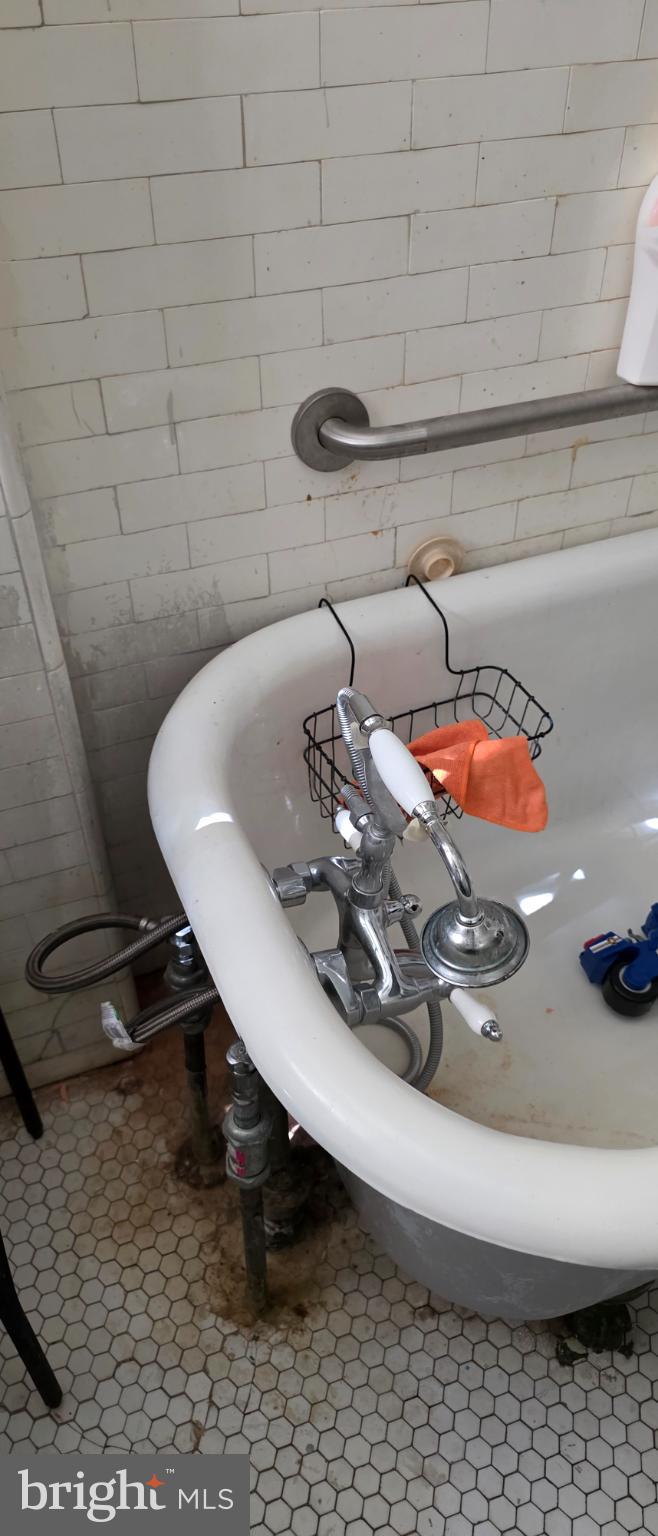 1116 Allison Street Northwest Washington, DC 20011 - Photo 11 of 41 a bathroom with a sink and a mirror