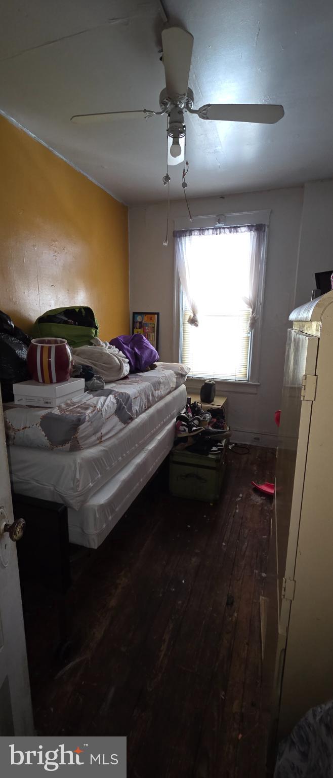 1116 Allison Street Northwest Washington, DC 20011 - Photo 23 of 41 a bedroom with a bed and a chandelier