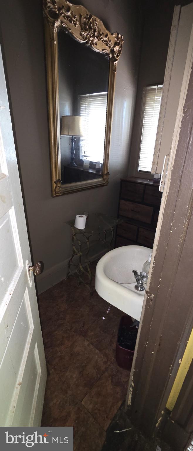 1116 Allison Street Northwest Washington, DC 20011 - Photo 29 of 41 a bathroom with a sink and a mirror