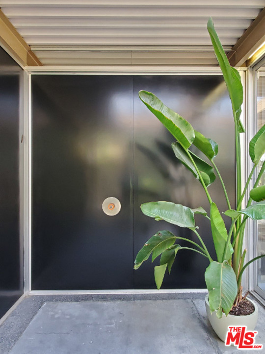 11468 Dona Cecilia Drive Studio City, CA 91604 - Photo 1 of 1 a vase of flowers sitting on a table