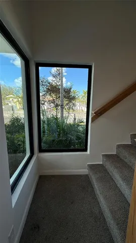 a view of a room with a large window