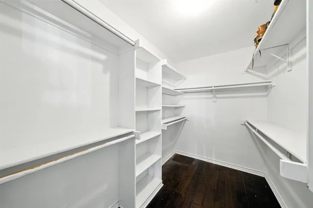 a bathroom with a bathtub a mirror a sink and a shower