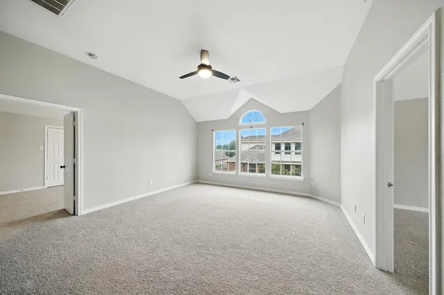 a spacious bathroom with a granite countertop sink a mirror and a shower