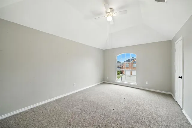 a view of a hallway with wooden shelves