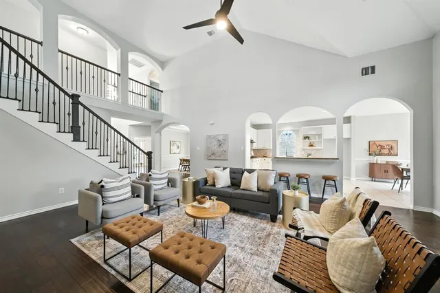 a living room with furniture or couch and a dining table