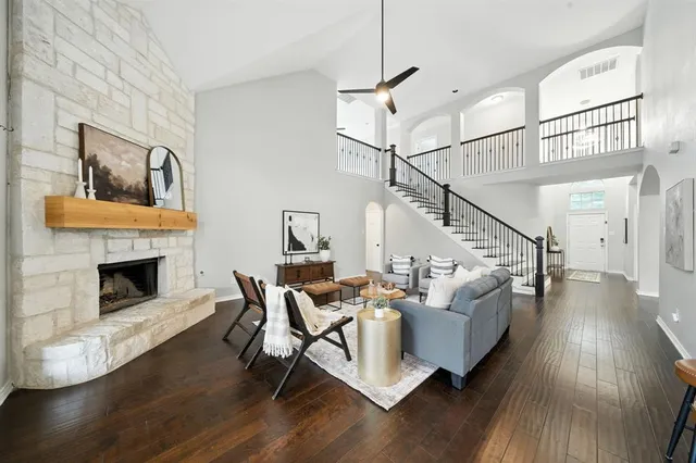 a living room with furniture and a fireplace