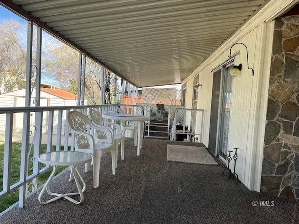 a view of a porch with furniture