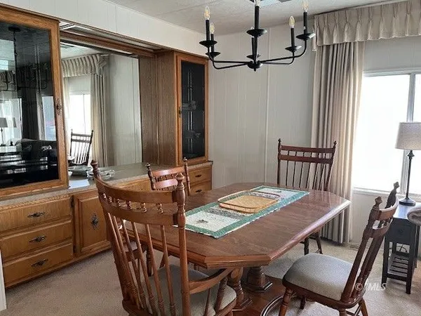 a kitchen with a sink cabinets and wooden floor