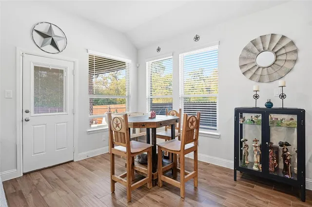 a kitchen with lots of clutter and cabinets