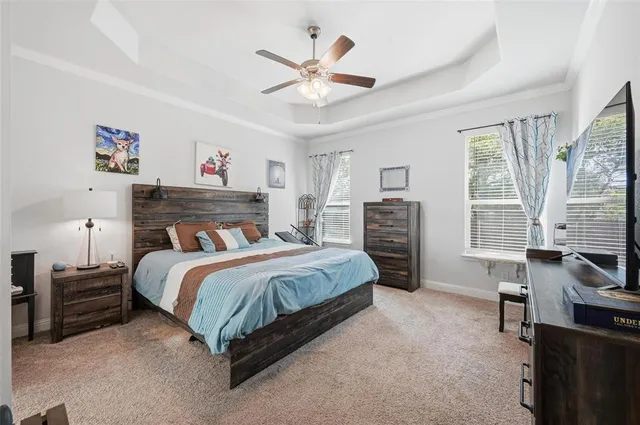 a spacious bathroom with a double vanity sink mirror and bathtub