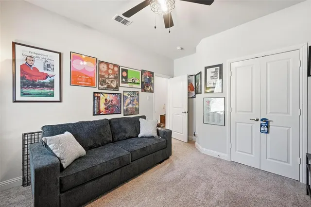 a bathroom with a double vanity sink toilet and shower