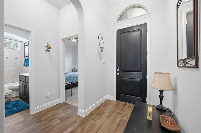 a large kitchen with a table and chairs