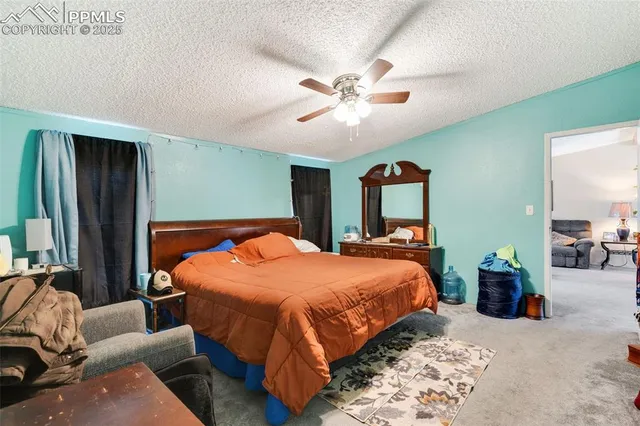 a bedroom with bed and window