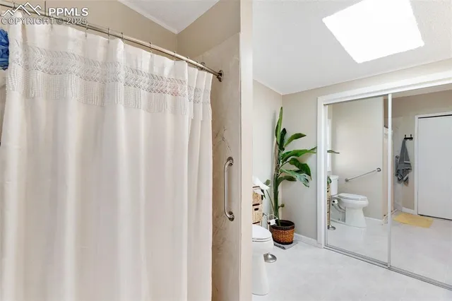 a view of entryway with livingroom and flower pot