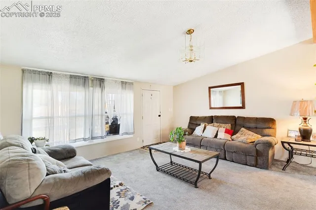 a living room with furniture and a couch