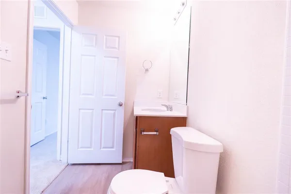 a bathroom with a toilet a sink and bathtub