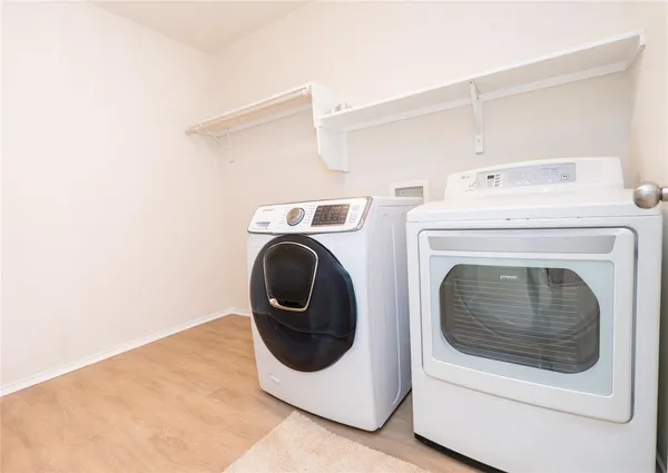 a utility room with dryer and washer