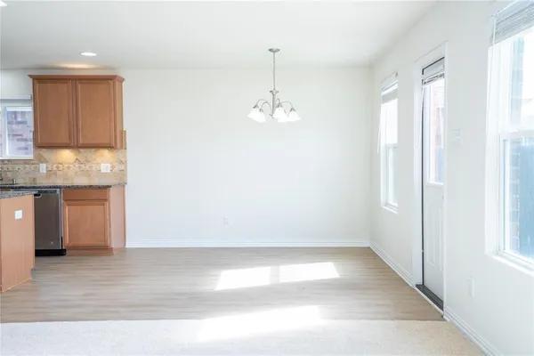 a view of a kitchen with a sink and dishwasher