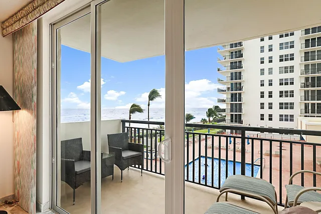 a view of a balcony with chairs