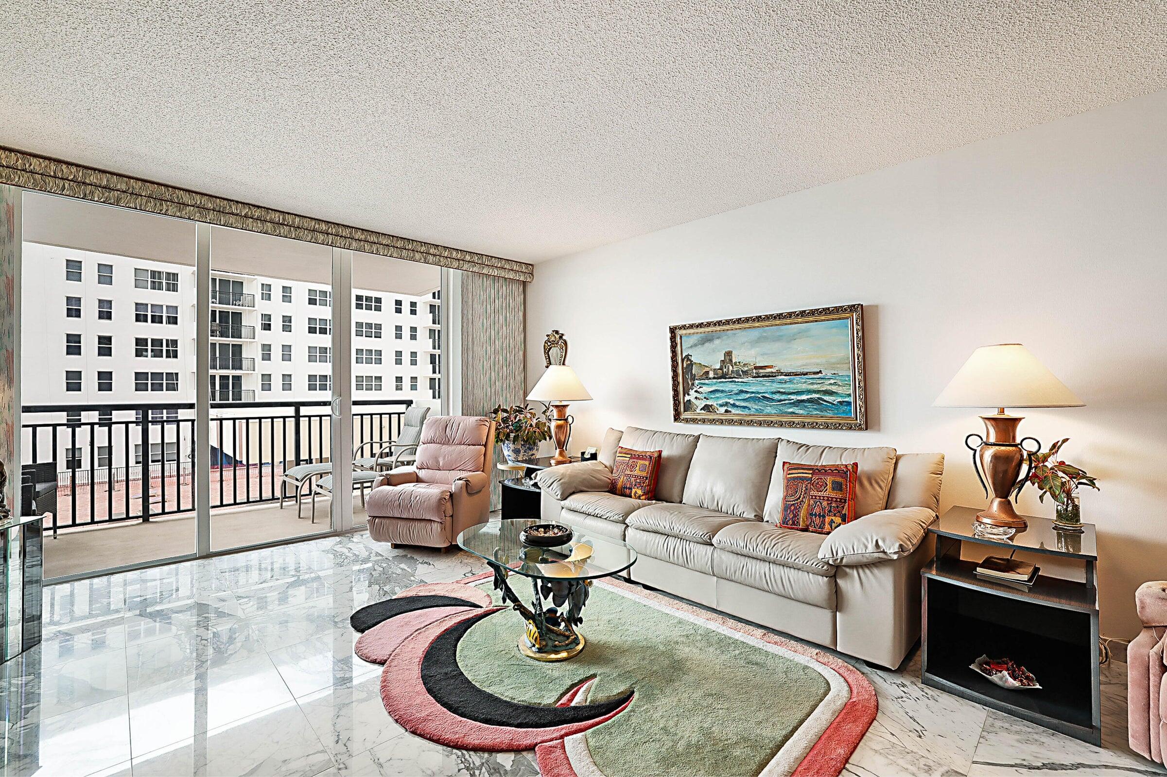 1149 Hillsboro Mile, Unit 310 Hillsboro Beach, FL 33062 - Photo 11 of 33 a living room with furniture and a floor to ceiling window
