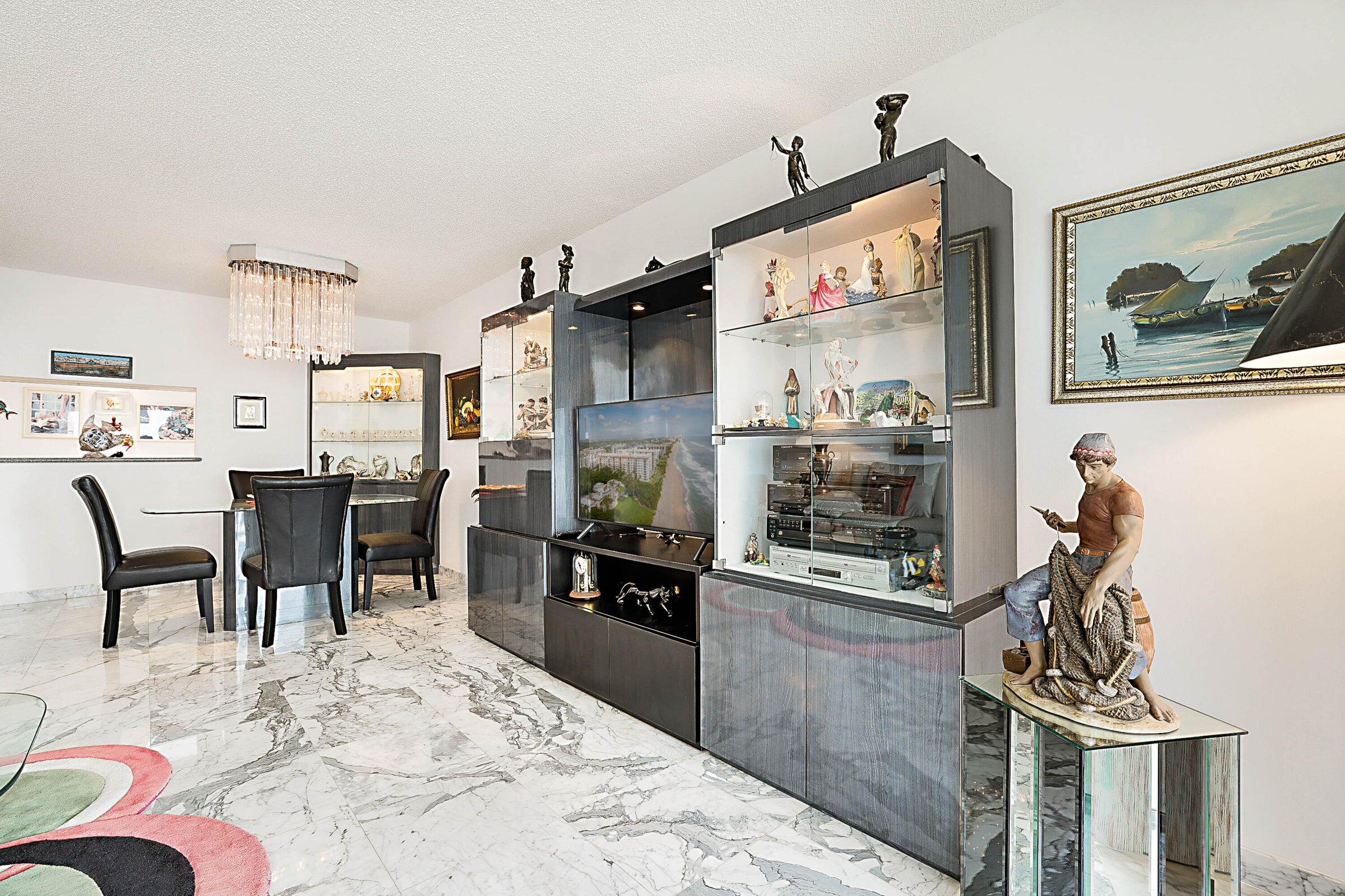 1149 Hillsboro Mile, Unit 310 Hillsboro Beach, FL 33062 - Photo 12 of 33 a kitchen with stainless steel appliances kitchen island granite countertop a refrigerator and a stove top oven