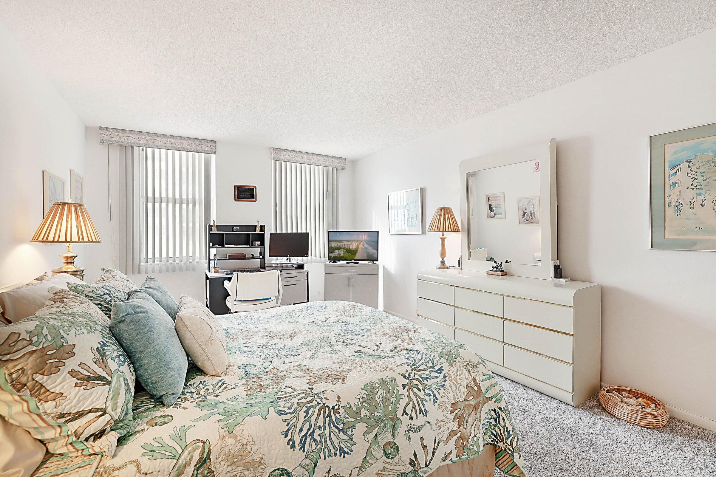 1149 Hillsboro Mile, Unit 310 Hillsboro Beach, FL 33062 - Photo 23 of 33 a large bedroom with a bed and a view of kitchen