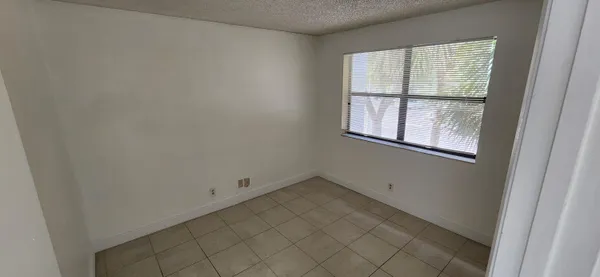 a view of balcony with wooden floor