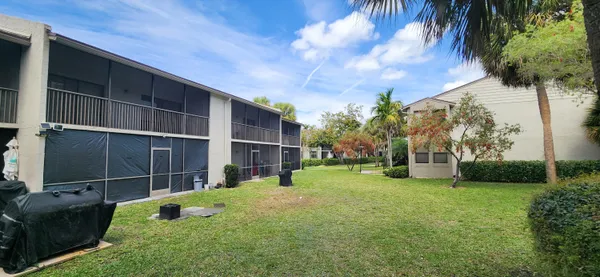 a view of a garden with houses