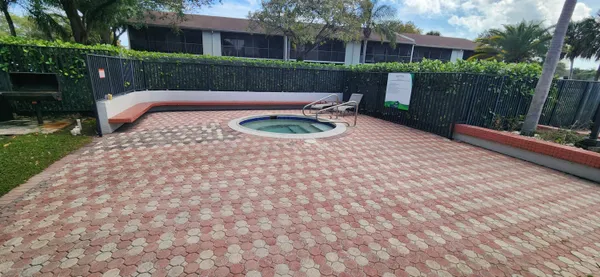a view of a bench in the backyard