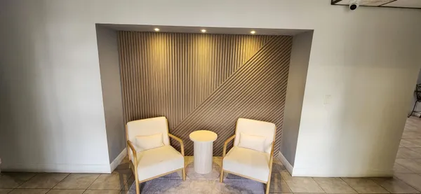 a kitchen with granite countertop a sink cabinets and appliances