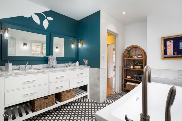 a bath tub sitting next to a window