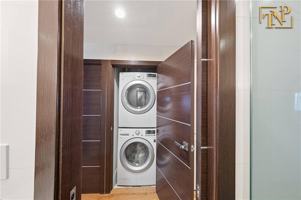 2854 Brighton 4th Street, Unit 6 Brooklyn, NY 11235 - Photo 14 of 19 a utility room with dryer and washer