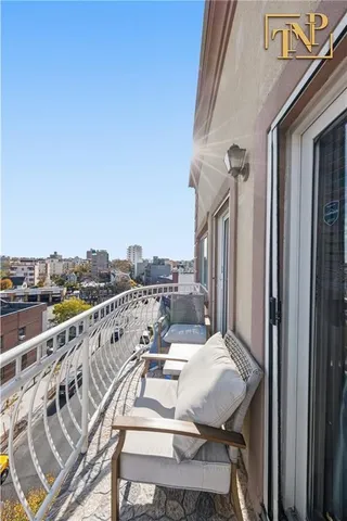 a view of a balcony with furniture