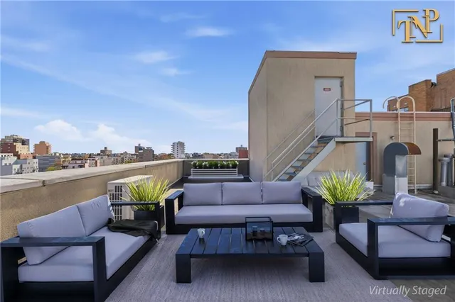 a swimming pool with outdoor seating and barbeque oven