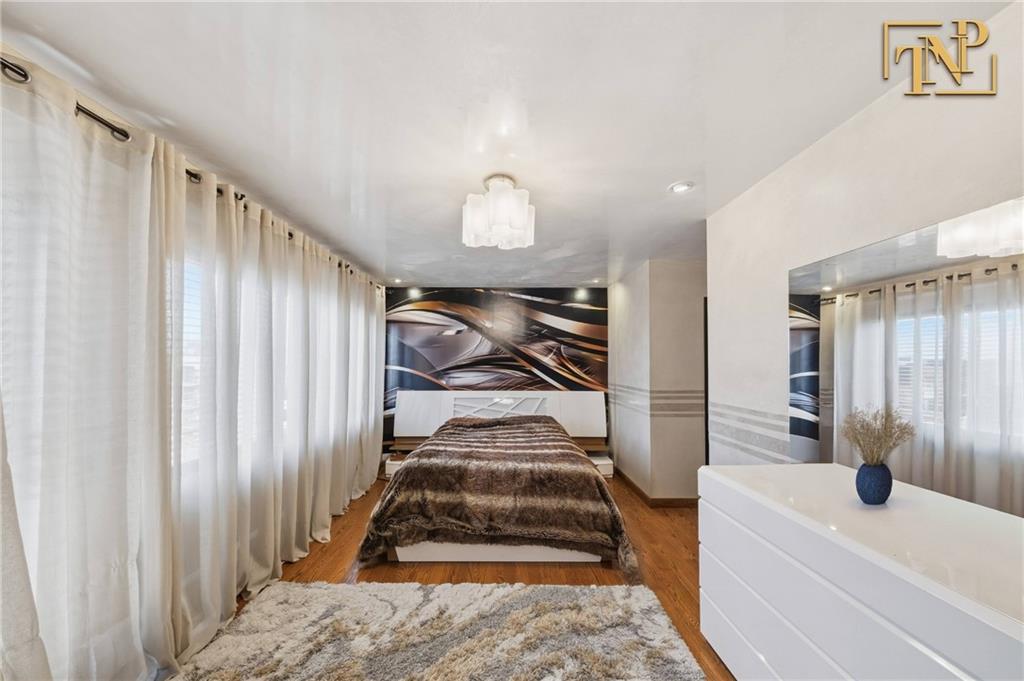 2854 Brighton 4th Street, Unit 6 Brooklyn, NY 11235 - Photo 7 of 19 a bathroom with a sink and a mirror