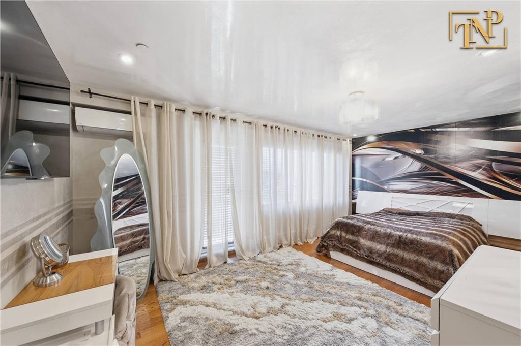 2854 Brighton 4th Street, Unit 6 Brooklyn, NY 11235 - Photo 8 of 19 a view of a livingroom with furniture and staircase