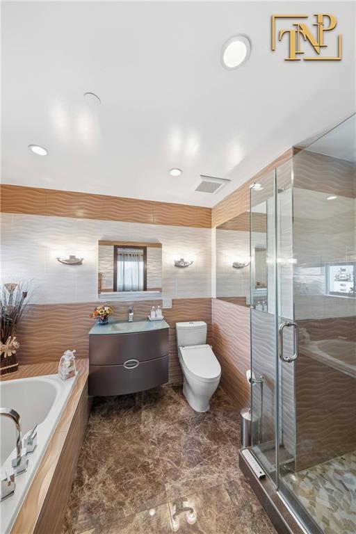 2854 Brighton 4th Street, Unit 6 Brooklyn, NY 11235 - Photo 10 of 19 a bathroom with a granite countertop sink and toilet