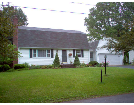 81 Albemarle Road Longmeadow, MA 01106 - Photo 1 of 16 a front view of house with a garden and patio