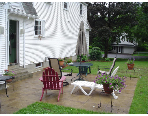 81 Albemarle Road Longmeadow, MA 01106 - Photo 14 of 16 a view of a chairs and table in patio with a barbeque grill