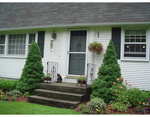 81 Albemarle Road Longmeadow, MA 01106 - Photo 5 of 16 a front view of a house with plants and garden