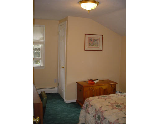 81 Albemarle Road Longmeadow, MA 01106 - Photo 7 of 16 a room with a bed and a mirror