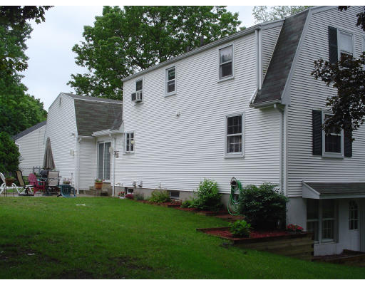 81 Albemarle Road Longmeadow, MA 01106 - Photo 10 of 16 a front view of a house with a garden and plants