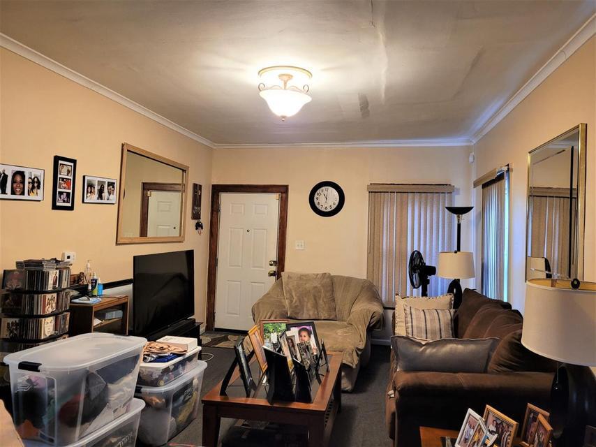 1718 Roosevelt Place Gary, IN 46404 - Photo 3 of 18 a living room with furniture and a flat screen tv