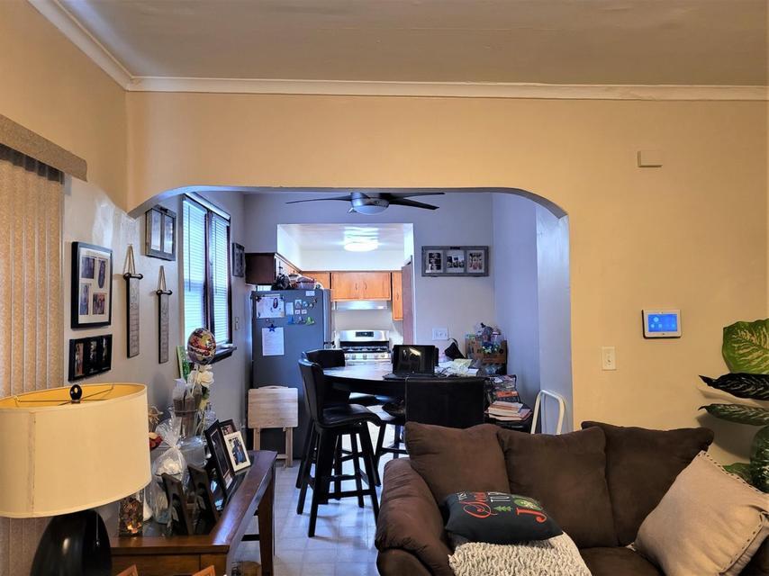 1718 Roosevelt Place Gary, IN 46404 - Photo 4 of 18 a view of a dining room with furniture and wooden floor